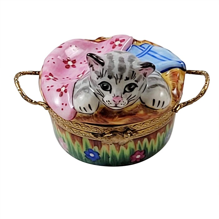 Hand-painted Limoges box featuring a cat design showcasing French artisanal luxury and detailed craftsmanship
