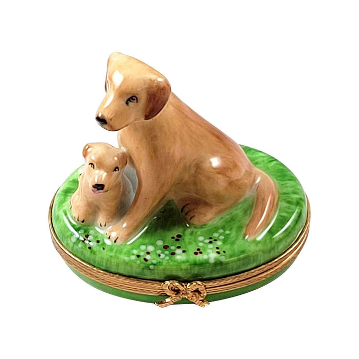 Limoges porcelain trinket box featuring two dogs on green base representing French Heritage craftsmanship