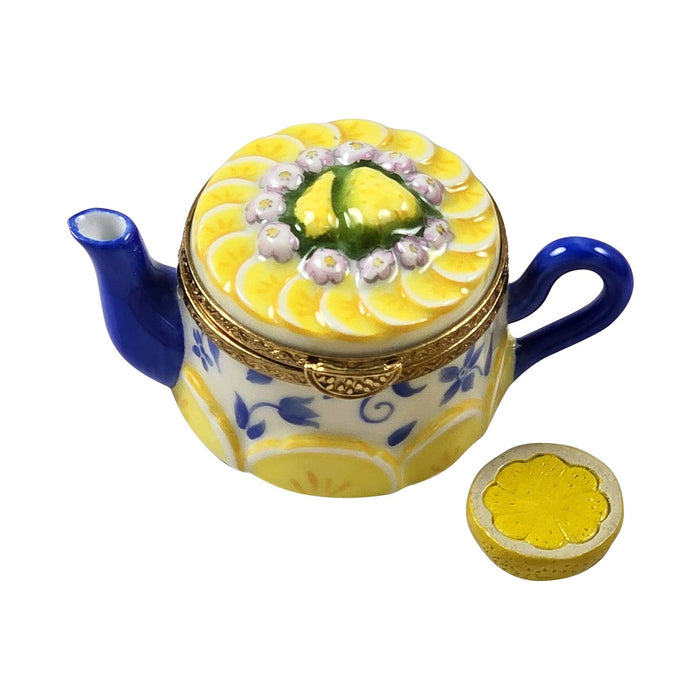 Porcelain Limoges teapot trinket box with yellow floral design used to show how to identify authentic Limoges boxes