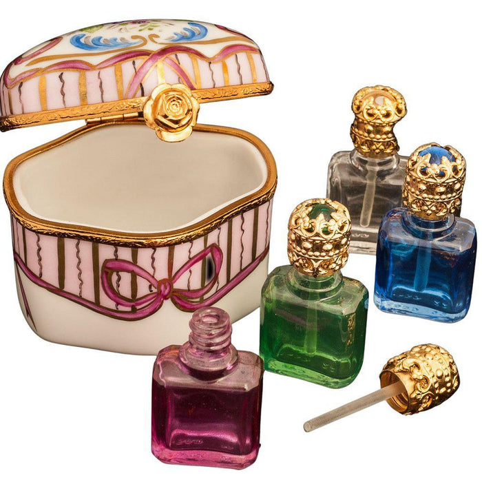 Elegant porcelain for home decor featuring a decorative Limoges trinket box and ornate small glass perfume bottles
