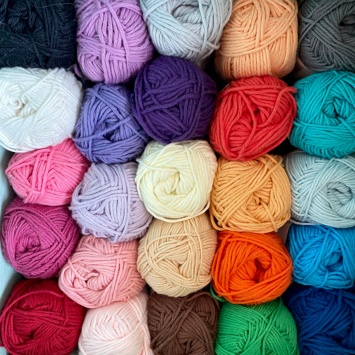 pink blue and yellow yarn