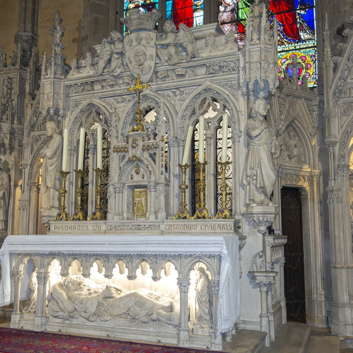 Intricately carved altar inside a historic church showcasing detailed stone collecting Limoges porcelain tips