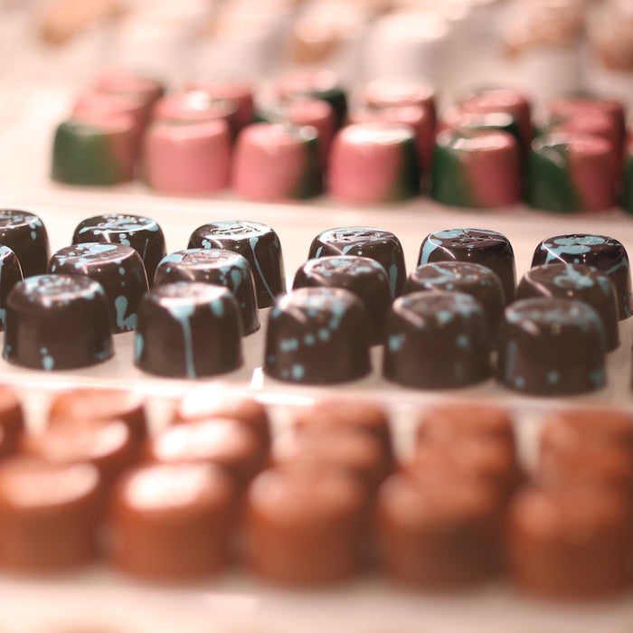 a table topped with lots of chocolate candies