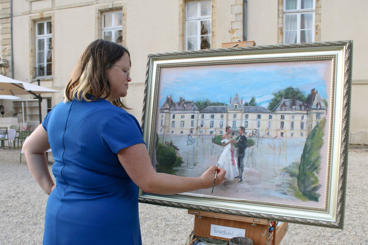 Artist paints a wedding scene at a chateau