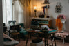 A sewing room with a vintage sewing machine and supplies.
