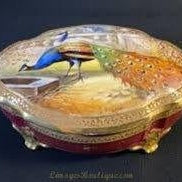 Decorative Limoges box featuring a colorful peacock design, one of the most popular types of Limoges boxes