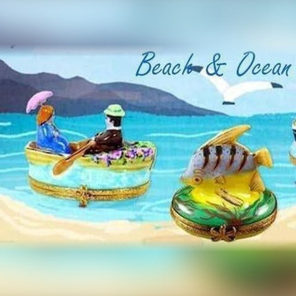 Hand painted beach themed porcelain boxes featuring a couple in a boat and a tropical fish design