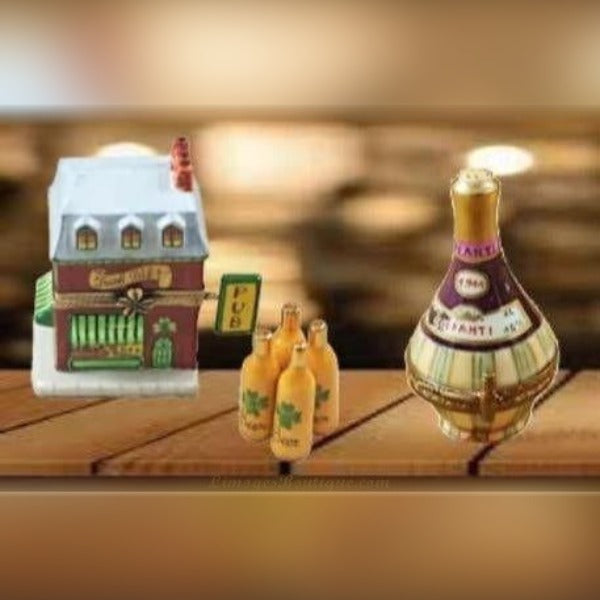 Hand-painted wine themed Limoges boxes featuring a pub, beer bottles, and a champagne bottle on wooden surface