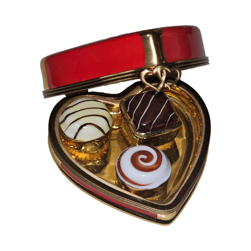Fine French craftsmanship on the Always Je T'aime Red Heart with Removable Chocolates Limoges box, painted by hand