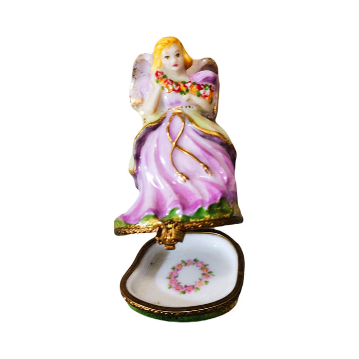 Fine art lovers will admire this Pink Angel with Flowers Limoges box