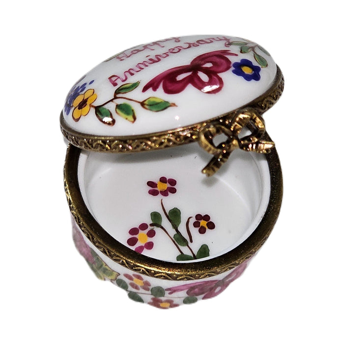 Fine art lovers will admire this Mini Happy Anniversary Round Limoges box