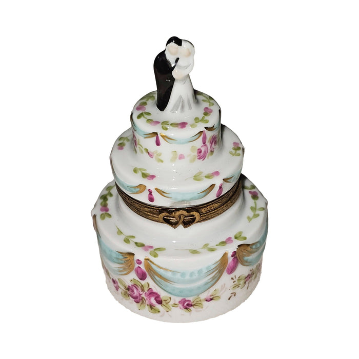 Limoges Boutique presents the White Wedding Cake with Couple, a genuine Limoges box painted by hand in France