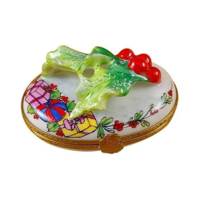 Limoges Boutique presents the Rochard Holly Leaf on Oval, a genuine Limoges box painted by hand in France