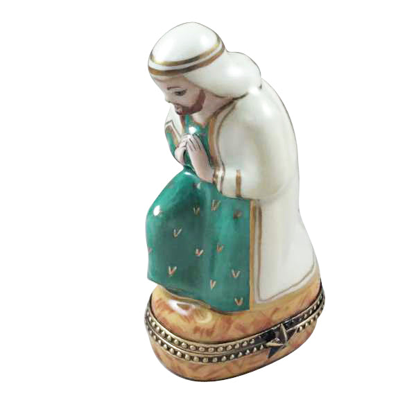 Joseph in a white robe and green cloak with hands folded in prayer, satin-finish Rochard nativity figure