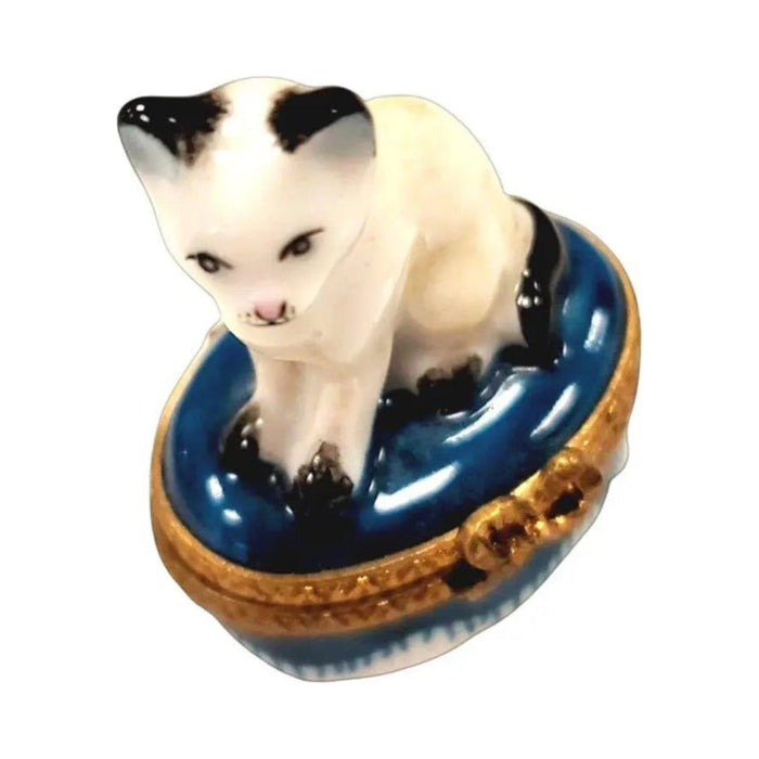 Fine French craftsmanship on the Mini White Siamese Cat Limoges box, painted by hand