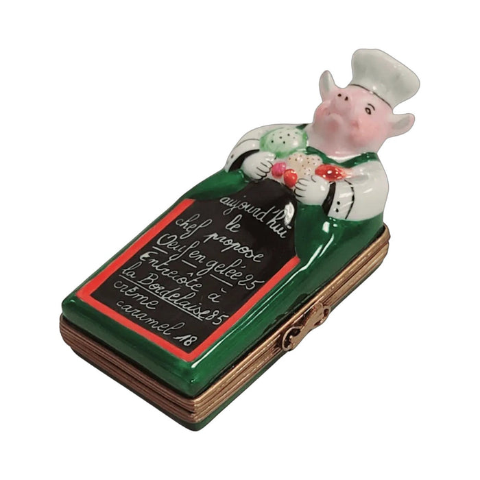 Painted details on the Pig Chef with Menu Limoges box, French art in miniature
