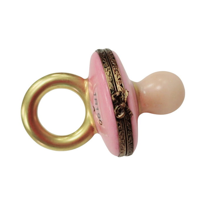 Limoges Boutique presents the Pink Baby Pacifier, a genuine Limoges box painted by hand in France