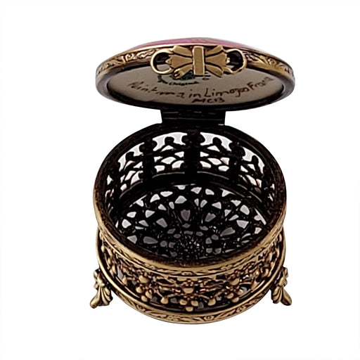 Small Round Pink with Flowers and Ornate Brass Limoges box opened to show the inside, a keepsake to tuck a treasure in