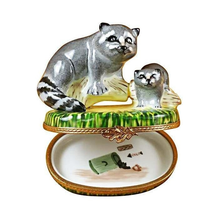 Fine French craftsmanship on the Raccoon with Baby Limoges box, painted by hand