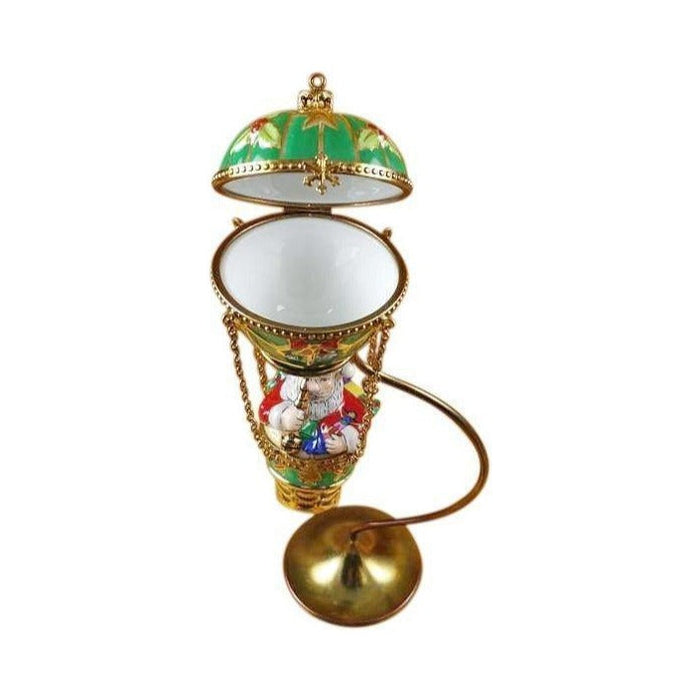Fine art lovers will admire this Santa in Hot Air Balloon with Brass Stand Limoges box