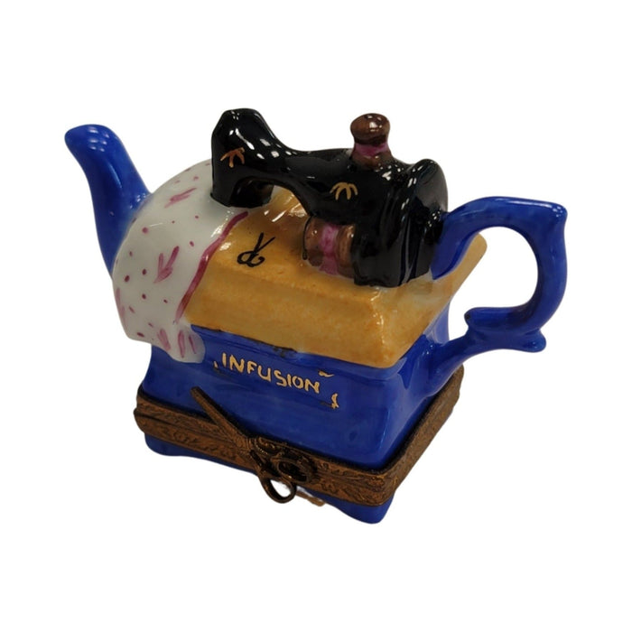 Fine French craftsmanship on the Sewing Machine Teapot Limoges box, painted by hand