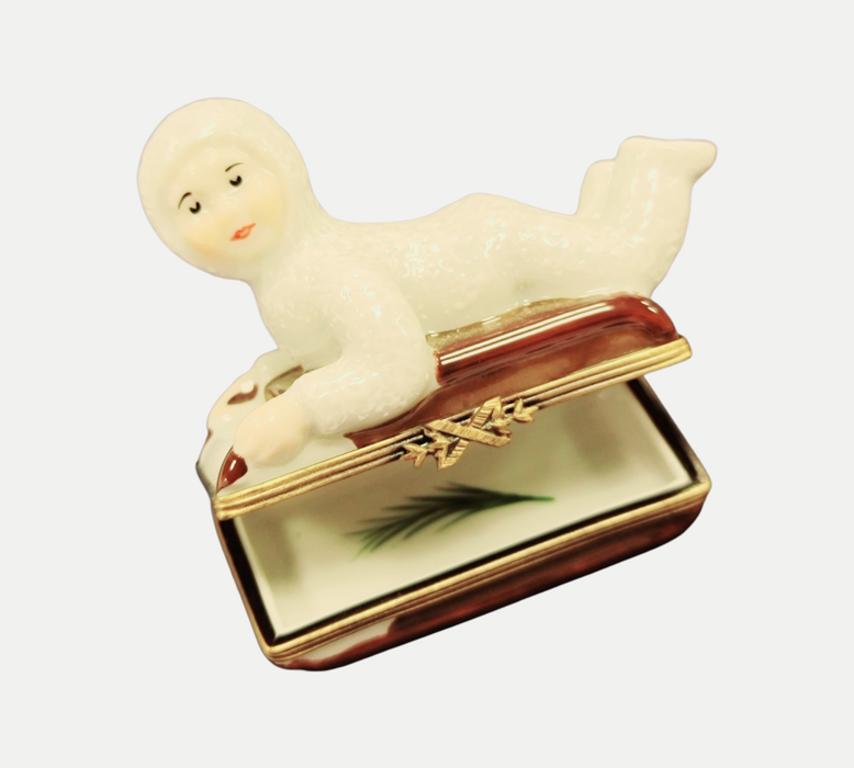Snowbaby Sledding Adventure Box for Winter Enthusiasts Porcelain Limoges xmas French Trinket Box