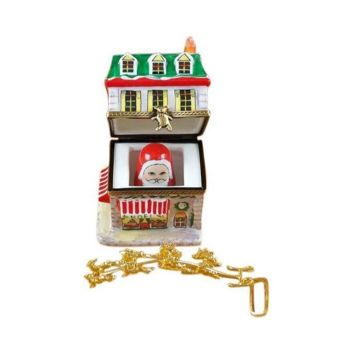 The painter's artistry shows on this House with Santa and Brass Reindeer Limoges box