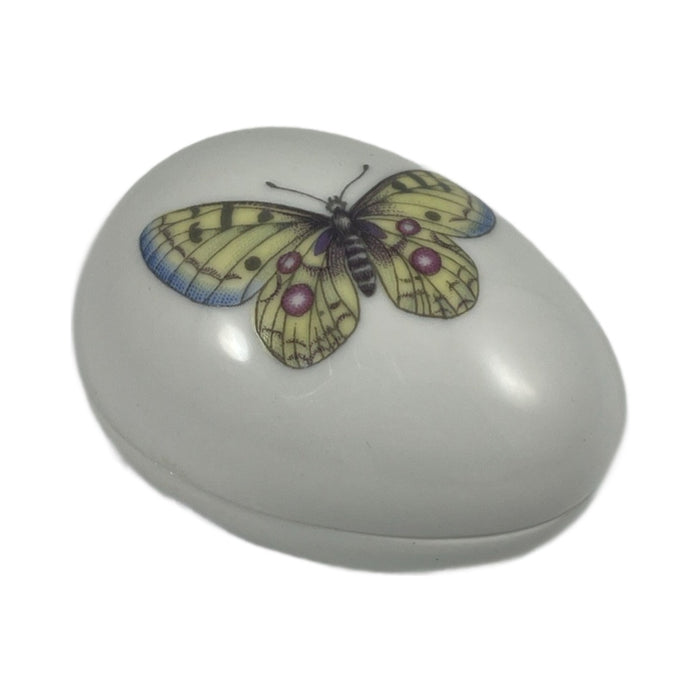 White porcelain egg Limoges box with a painted yellow butterfly, no hinge, made in France
