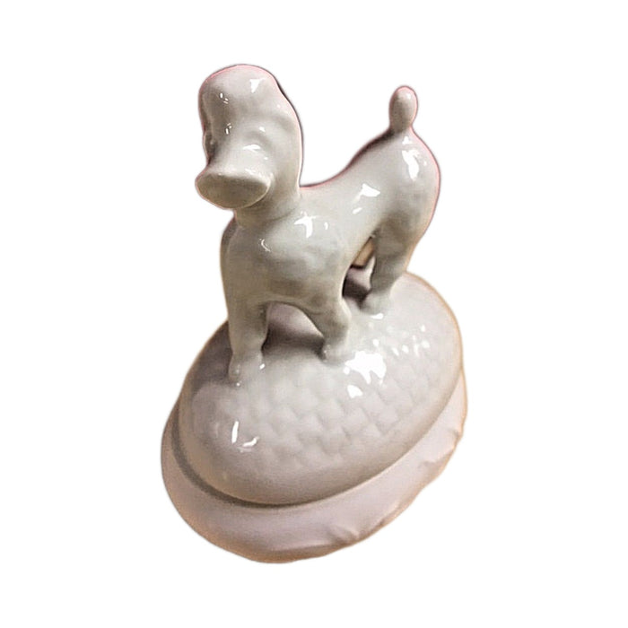 Side view of the French poodle Limoges box, white porcelain with a lift-off lid