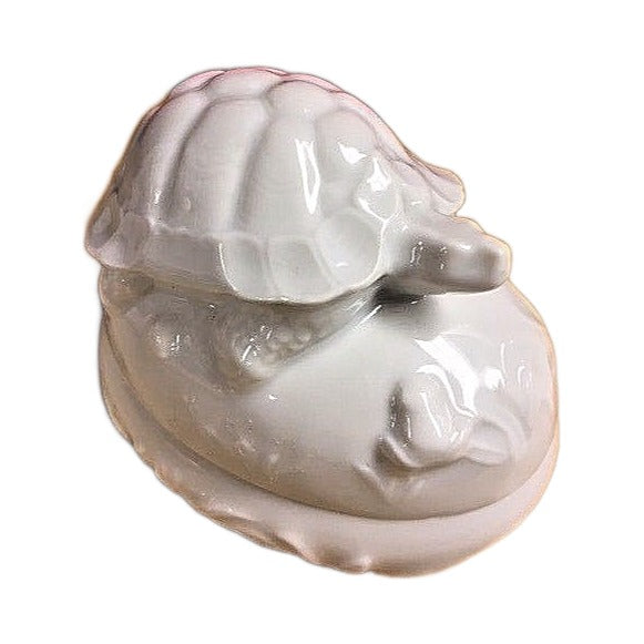 Detail of the tortoise on the white Limoges porcelain box