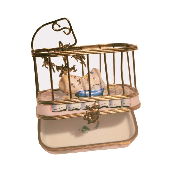 Painted details on the Baby in Playpen Limoges box, French art in miniature