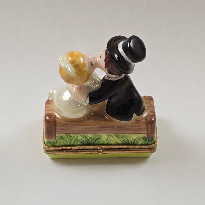 KISSING COUPLE ON BENCH