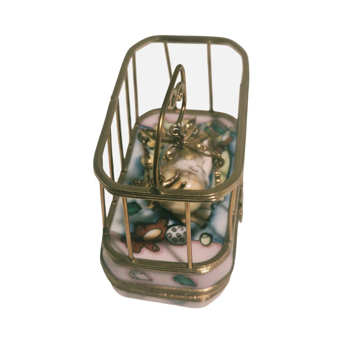 Every brushstroke by hand on the Baby in Playpen Limoges box from France