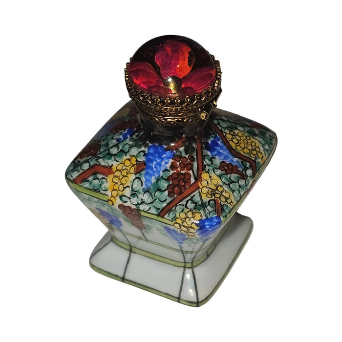 Fine French craftsmanship on the Colorful Flowers on Tent Bottle Limoges box, painted by hand