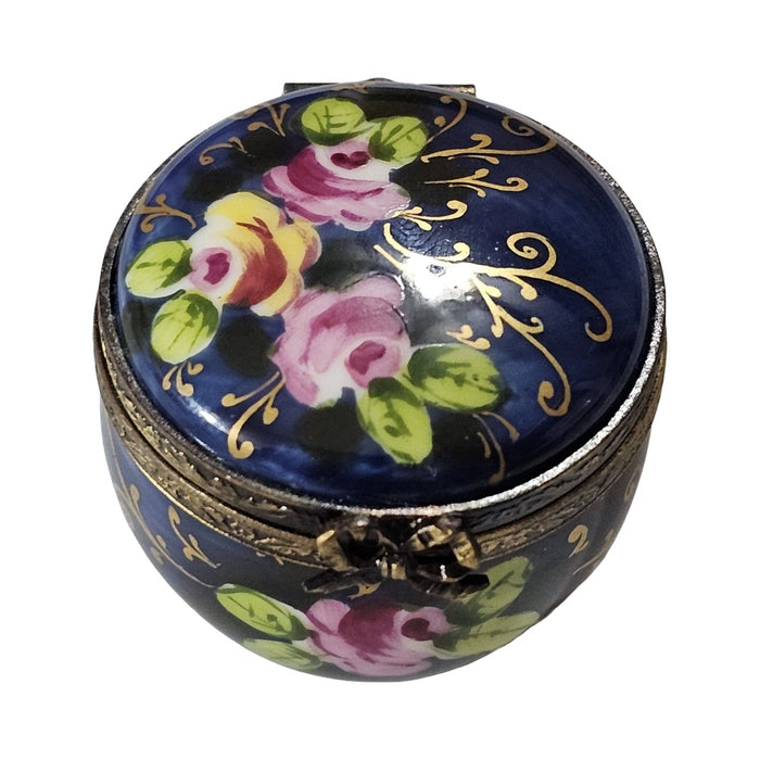 Fine French craftsmanship on the Cobalt Blue Round with Roses Limoges box, painted by hand