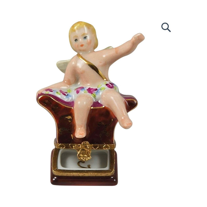 Painted details on the Sitting Angel Limoges box, French art in miniature