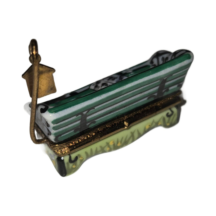 The painter's artistry shows on this Small Garden Bench Charm Limoges box