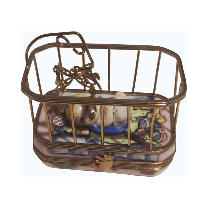 Artisan-painted Baby in Playpen Limoges box from France, a cherished collectible