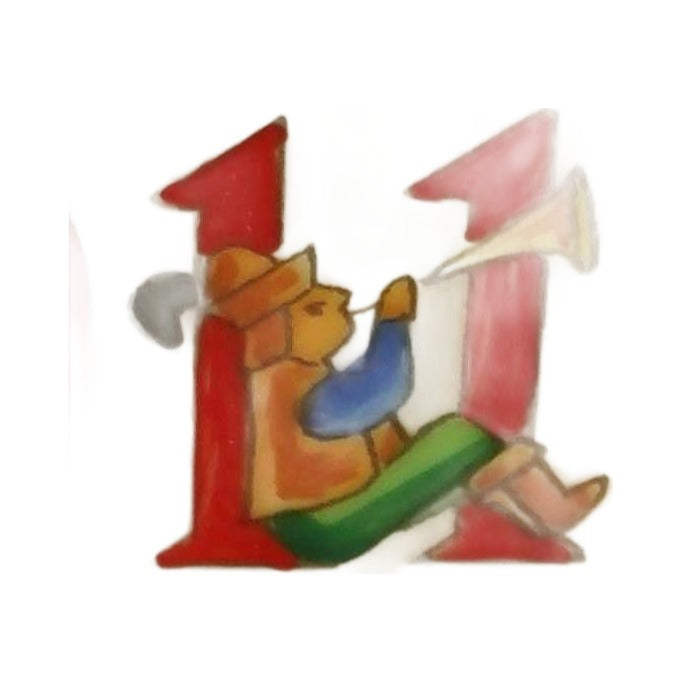 Eleven pipers piping, a piper with a gold horn on the red 11 of the Rochard Christmas box