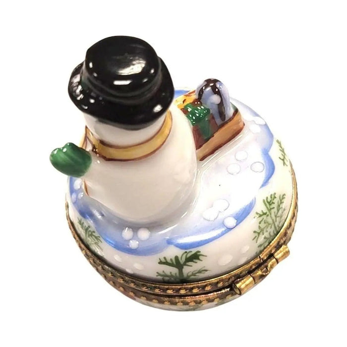 Painted details on the Christmas Snowman Waving Limoges box, French art in miniature