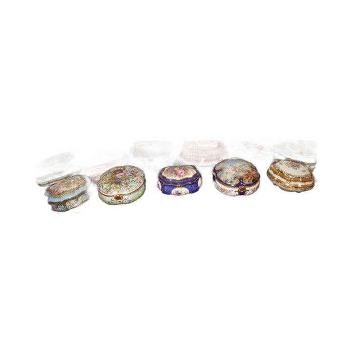 A collector's shelf lined with hand-painted Limoges boxes, French porcelain artistry on display