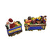 Santa's engine and a wagon piled with toys, the two-piece Christmas train in hand-painted Limoges porcelain