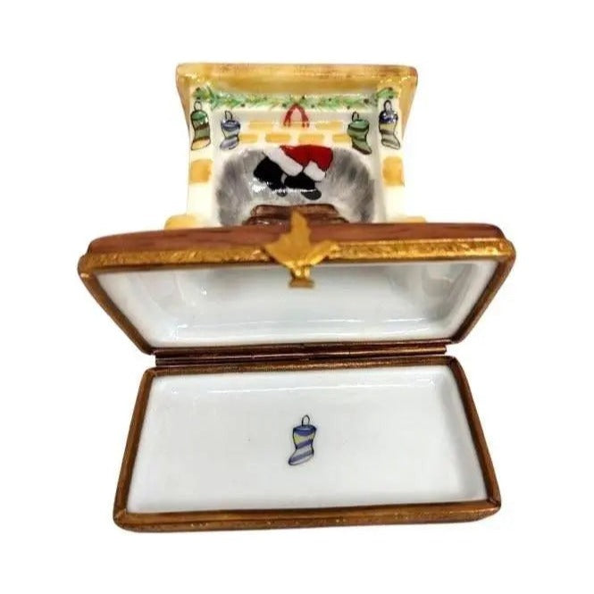 Artisan-painted Santa in Fireplace Christmas Limoges box from France, a cherished collectible