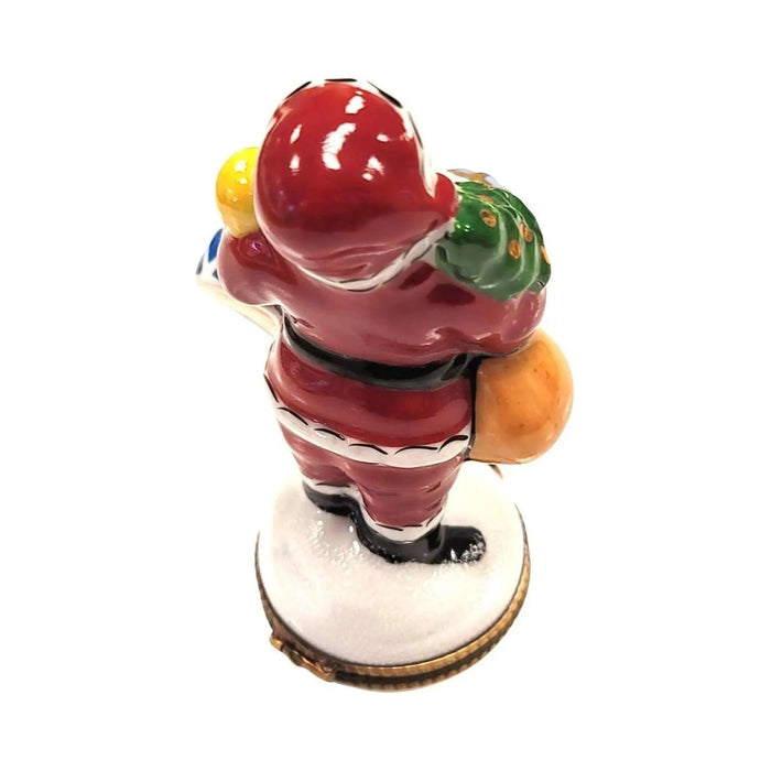 Fine French craftsmanship on the Santa Tree with Gifts Limoges box, painted by hand