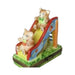 Limoges Boutique presents the Teddy Bear on Slide, a genuine Limoges box painted by hand in France